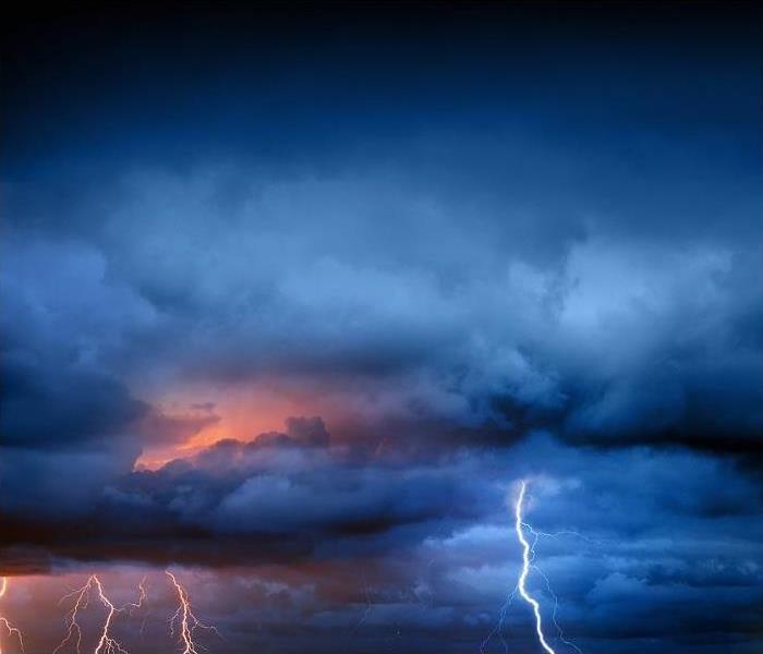 Storm clouds; lightning seen in storm clouds